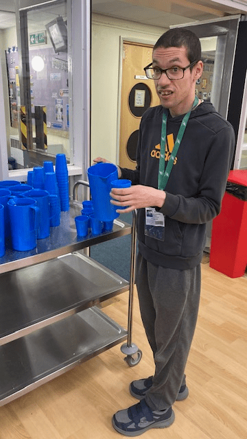 James Ashburner helping at the community fridge rpoject in Wellington